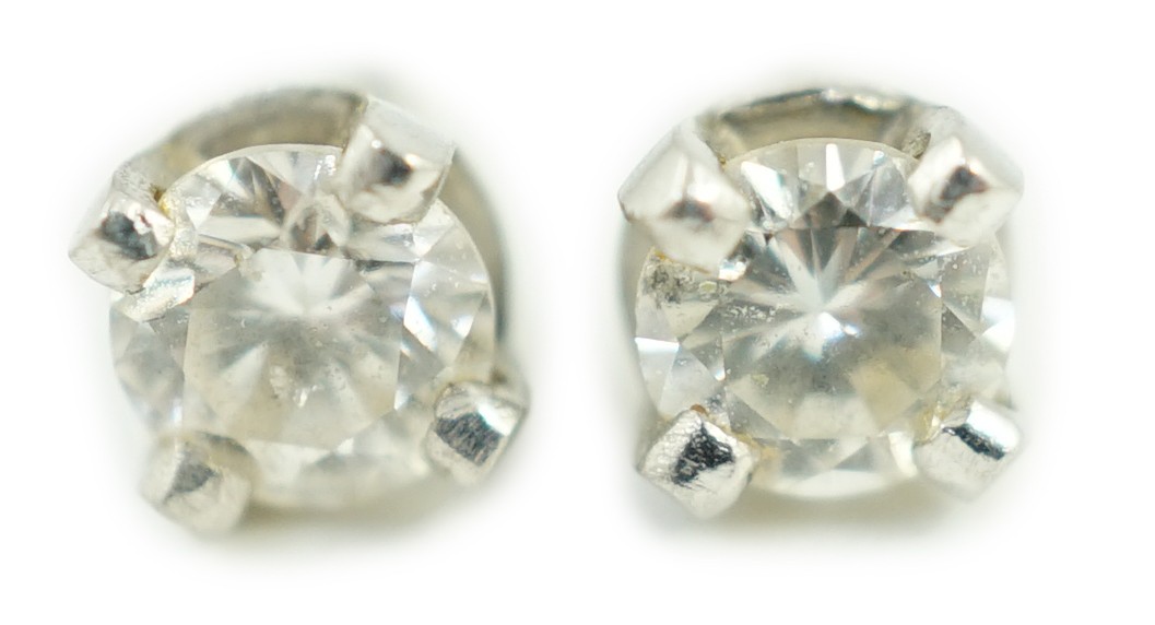 A pair of 9ct white metal and solitaire diamond ear studs, stone diameter approx. 3.4mm, gross weight 0.9 grams.